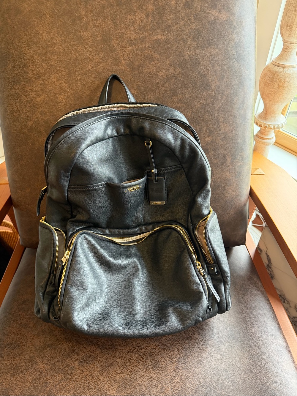 Tumi Black Leather Backpack with Gold Hardware